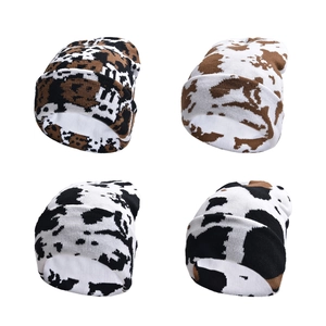 Winter knitted beanies with cow and leopard prints in four different animal patterns