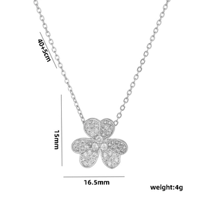 Silver lucky clover necklace with cubic zirconia stones on white background 45cm chain
