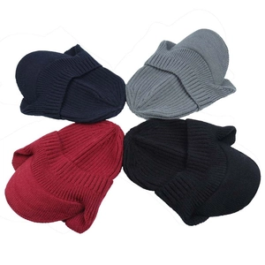 Flat lay of knit beanies in navy, gray, red, and black with ribbed texture and soft lining