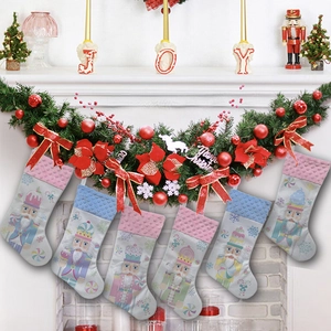Festive Nutcracker Christmas stockings set displayed on a decorated holiday fireplace
