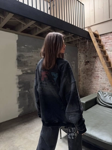 Detail of vintage washed charcoal grey oversize sweatshirt with back graphic print