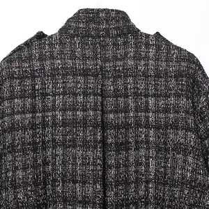 Close-up of the black and white tweed texture on back collar and shoulders area