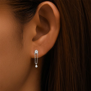 Close-up of S925 sterling silver ear stud featuring a fine chain and zircon stones
