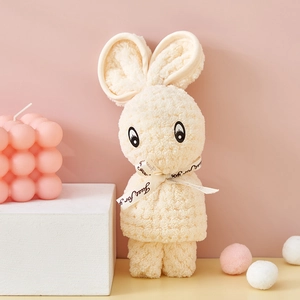 Detail of bunny-shaped cream coral fleece gift towel with 'Just for you' ribbon decoration