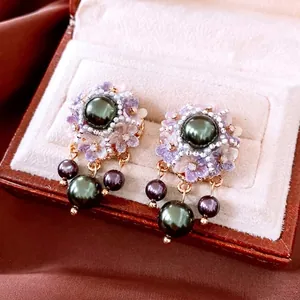 Vintage gold-plated floral earrings with emerald green pearls in a premium jewelry box