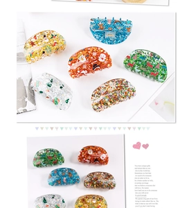 Close-up of colorful acrylic Christmas hair clips with sequins and festive patterns