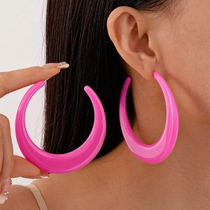Chic pink oversized acrylic hoop earrings with a glossy crescent geometric design