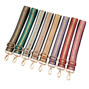 Adjustable striped canvas bag straps with gold metal hooks in multiple vibrant colors