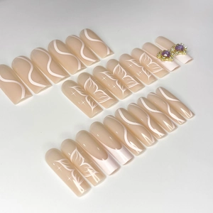 Barbie pink long coffin fake nails with 3D heart gems and butterfly wing art designs