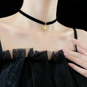 Vintage round star zircon choker necklace with gold sunburst pendant on black cord