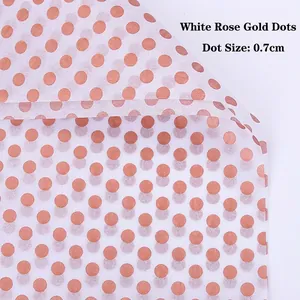 Detail of white tissue paper with 0.7cm rose gold polka dots for floral wrapping