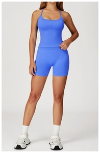 Detail of blue ribbed yoga set with thin straps and high-waisted seamless sports shorts