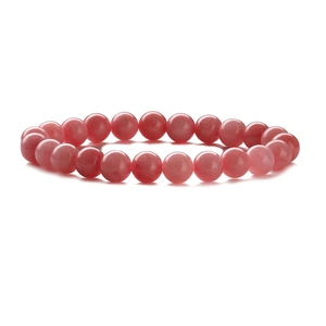 Close-up of polished 8mm pink natural stone beads with smooth translucent texture