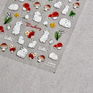 Gros plan de stickers 3D gaufrés pour ongles avec lapins blancs et fraises mignonnes
