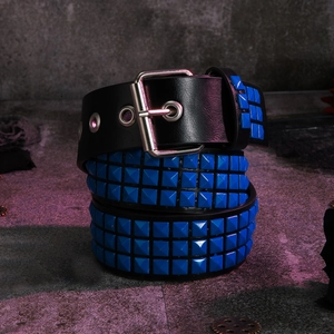 Detail of Y2K punk belt featuring three rows of blue pyramid studs and silver buckle
