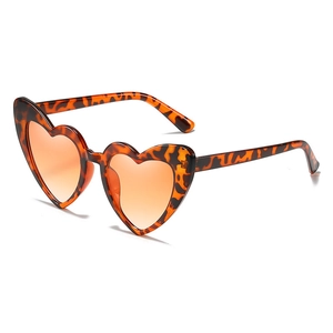 Fashionable heart-shaped sunglasses with leopard print frame and orange gradient lenses