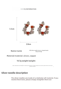 Detail view of C-shaped teardrop earrings showing 3.3x2.8cm dimensions and zircon stones