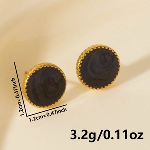 Detailed macro of 18K gold plated earrings with black spiral texture and 1.2cm diameter