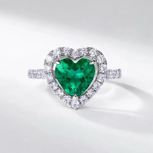 Luxury S925 silver heart-cut emerald ring with sparkling white diamond halo detail