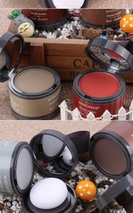 Detail of hair shadow powder with built-in mirror and puff on a wooden background