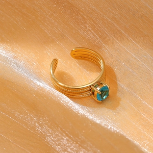 Elegant 18k gold plated stainless steel open ring with a blue zircon crystal inlay