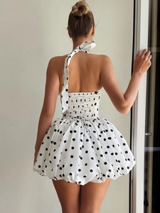 Women's backless halter neck polka dot dress with bubble skirt and lace-up back design