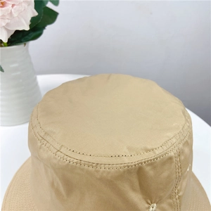 Top view of khaki cotton bucket hat showing detailed flat crown and double stitching