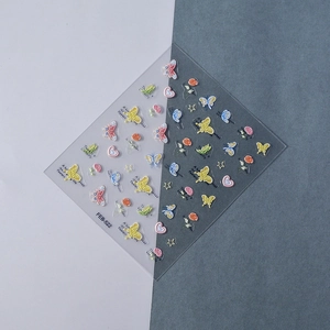 Detail of 3D embossed butterfly nail stickers with colorful floral and heart patterns