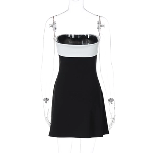 Detail of color-block patchwork seam on strapless black and white bodycon mini dress