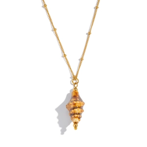 Detailed close-up of golden beaded chain with natural conch shell pendant on white background