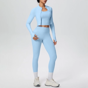 Three-piece light blue fitness set with zip jacket, sports bra, and high-waisted leggings