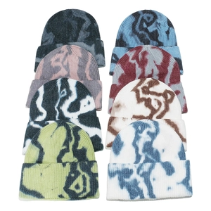 Colorful tie-dye knitted beanies in multiple shades for autumn and winter warmth