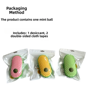 Detail of cat grooming brush kit including catnip ball and double-sided tape