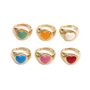 Detail of colorful drip oil heart rings in six vibrant colors with adjustable gold bands