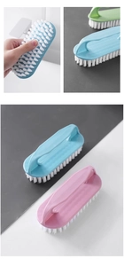 Detail of multi-purpose plastic laundry brushes with soft white bristles in various colors