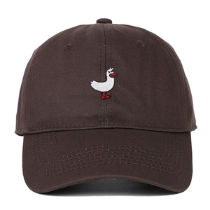 Close-up of the exquisite white duck embroidery on the brown cotton baseball cap detail