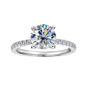Classic 2ct round moissanite ring with four-prong setting and pavé silver band