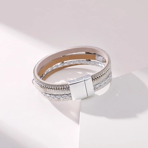 Detail shot of multi-layer wrap bracelet with silver ropes and magnetic square buckle