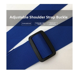 Macro shot of adjustable navy blue woven nylon shoulder strap with black plastic slide buckle