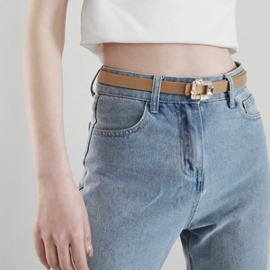 Detailed view of women's thin PU leather belt with sparkling rhinestone square gold buckle