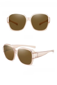 Detail view of large transparent tea-colored frame polarized sunglasses for women