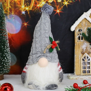 Detail of Christmas gnome with gray knit hat, white beard, and festive bokeh background