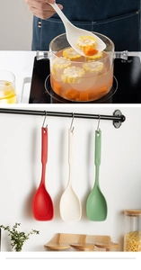 Detailed view of heat-resistant silicone ladle set in red, white and green colors