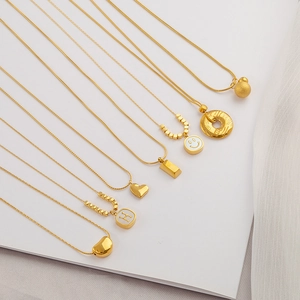 Golden heart, H-letter, and smiley face pendant necklaces with delicate snake chains