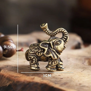 Detailed macro view of an antique bronze elephant figurine showing 3.5cm height and carvings