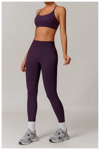 Detail of dark purple ribbed yoga set featuring a U-neck sports bra and high-waist leggings