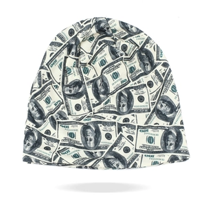 Detail of knitted slouchy beanie featuring a hip-hop style dollar bill print pattern