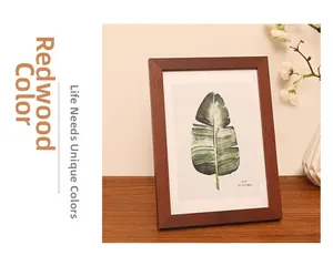 Detail of redwood color wooden photo frame in 5x7 inch size for table display