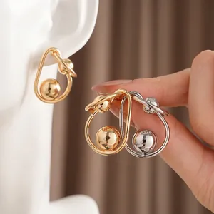 Fashion twisted metallic hoop earrings with polished balls in gold and silver finish