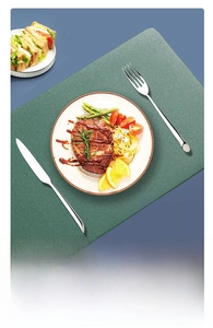 Close-up of flexible green faux leather placemat showing its rollable crease-free feature